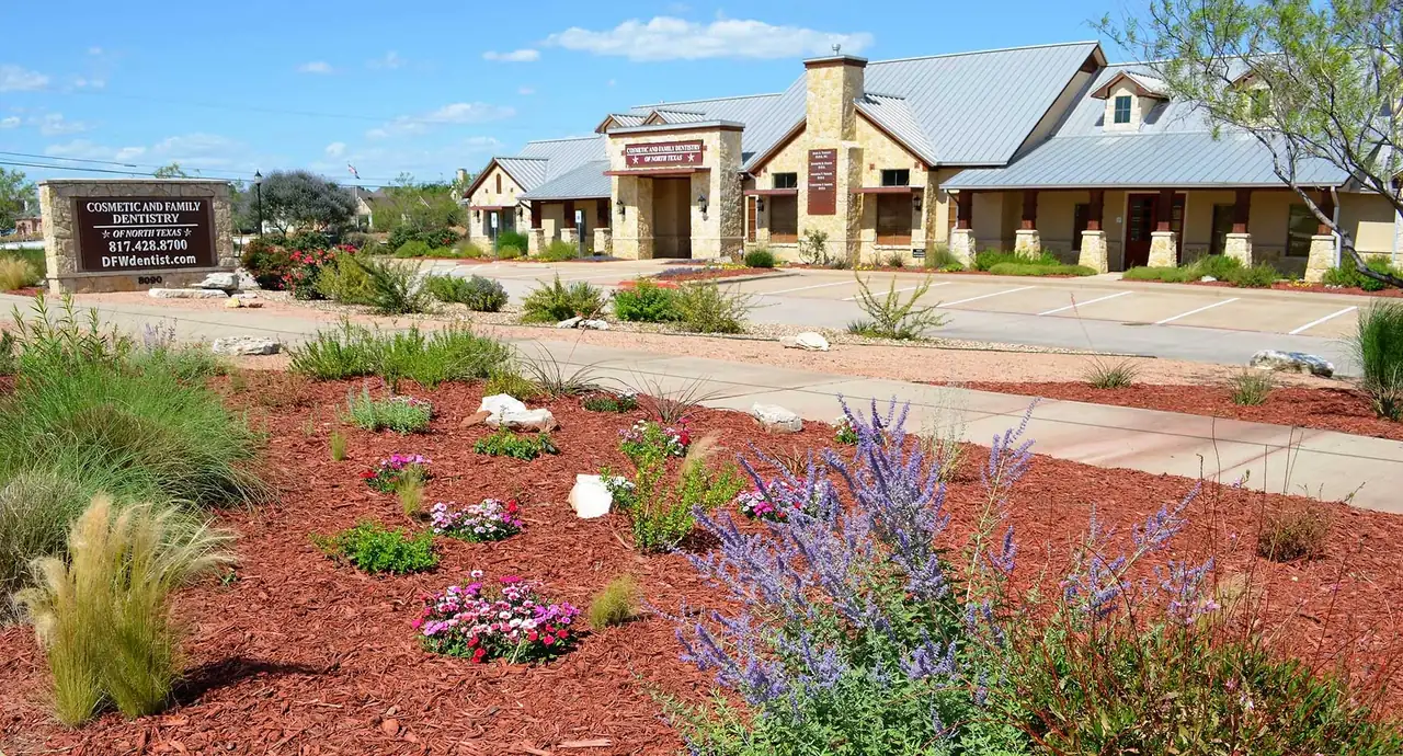 The practice's Hill Country stone building and xeriscape garden on Precinct Line Road, Colleyville, Texas.