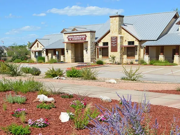 The practice's stone building and entrance on Precinct Line Road, Colleyville.