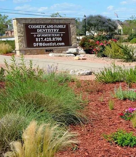 The practice's monument sign at 8090 Precinct Line Road, with the phone number and the Hill Country garden.